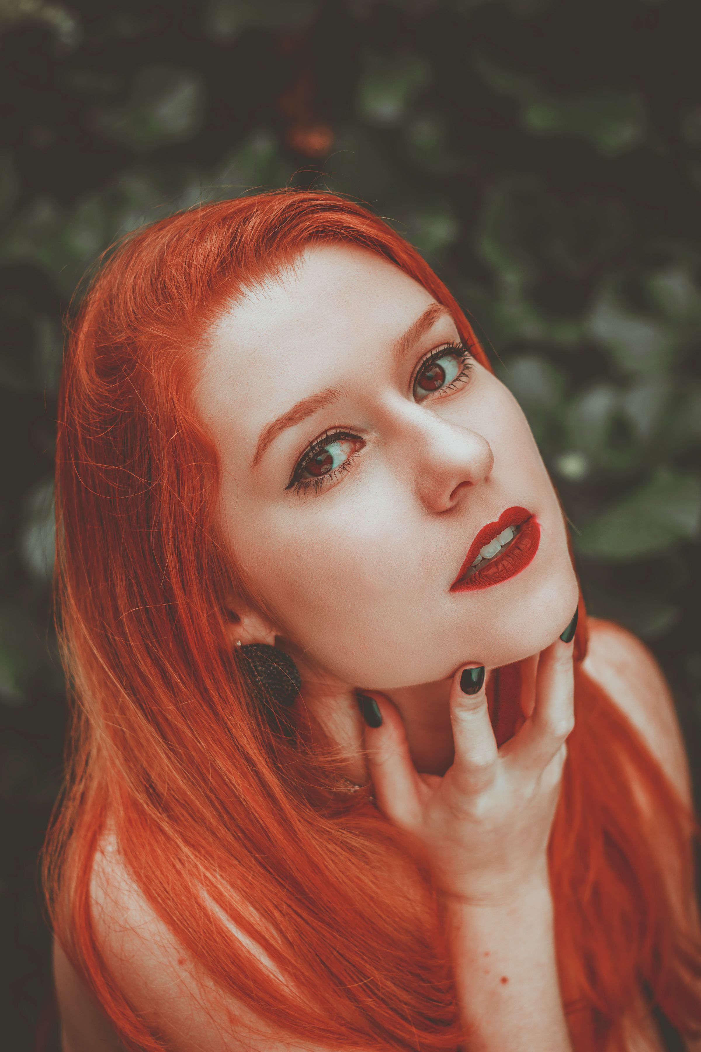Glossy, richly colored copper hair styled in waves