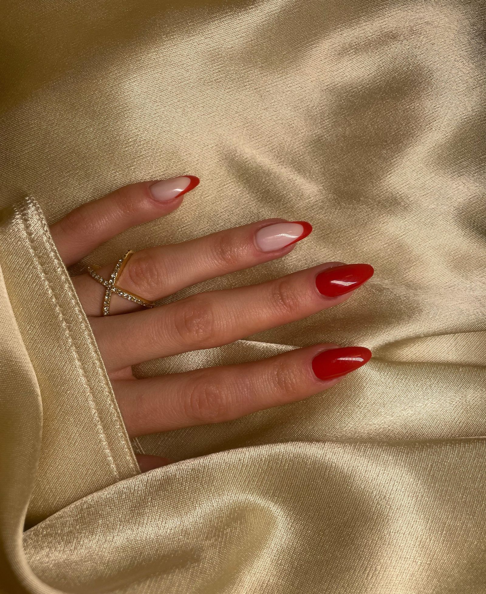 Elegant manicured hands with deep crimson polish