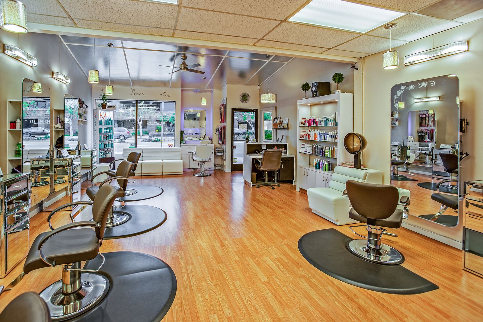 A calm, modern salon styling floor with chairs and mirrors — illustrative photography